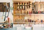 assorted handheld tools in tool rack