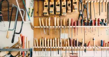 assorted handheld tools in tool rack